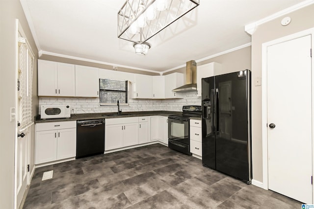 kitchen with wall chimney exhaust hood, white cabinets, a sink, and black appliances