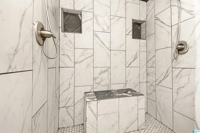 full bathroom with tiled shower