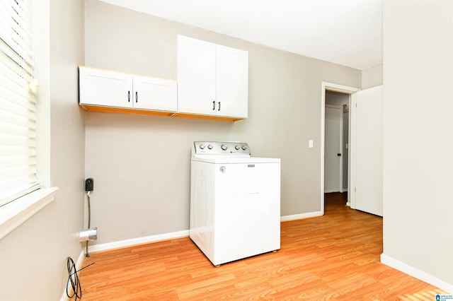 laundry room featuring baseboards, washer / clothes dryer, and light wood-style floors