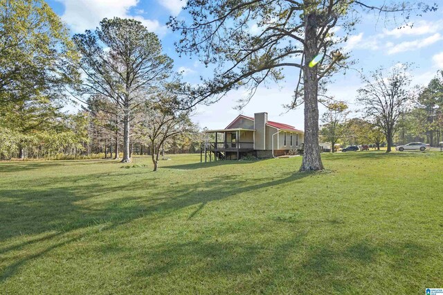 view of side of home featuring a lawn, ac unit, and cooling unit