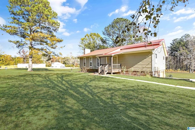 exterior space featuring a yard and a chimney