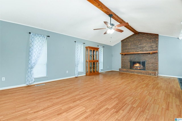 unfurnished living room featuring baseboards, visible vents, a ceiling fan, light wood-style flooring, and vaulted ceiling with beams