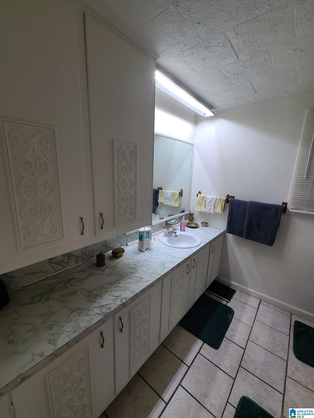 bathroom featuring vanity and tile patterned flooring