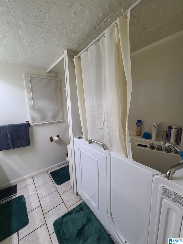 bathroom with crown molding, toilet, and tile patterned flooring