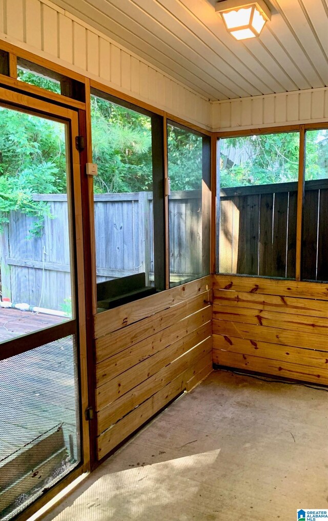 unfurnished sunroom featuring a healthy amount of sunlight