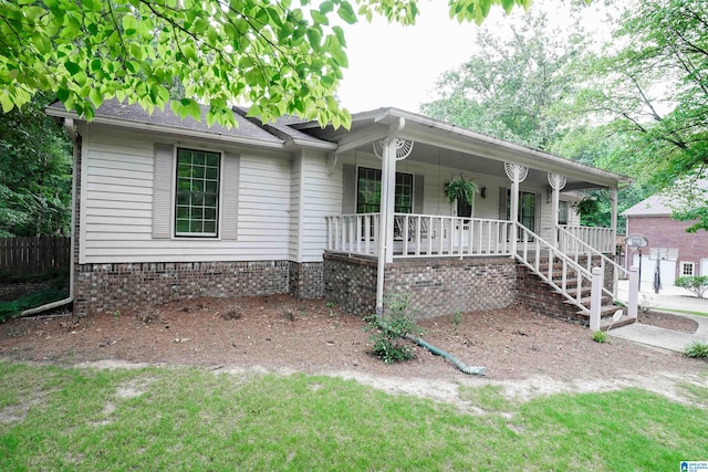 ranch-style home with covered porch