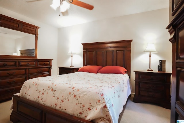 bedroom with ceiling fan and light colored carpet