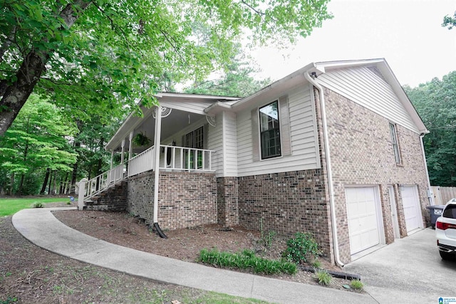 view of side of home featuring a garage