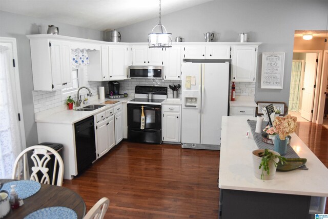 kitchen with lofted ceiling, stove, dark hardwood / wood-style floors, white refrigerator with ice dispenser, and sink