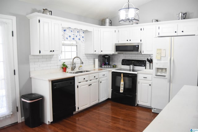 kitchen with dark hardwood / wood-style flooring, white appliances, sink, backsplash, and white cabinetry