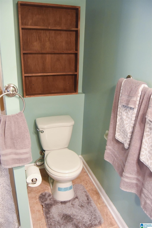 bathroom with tile patterned floors and toilet