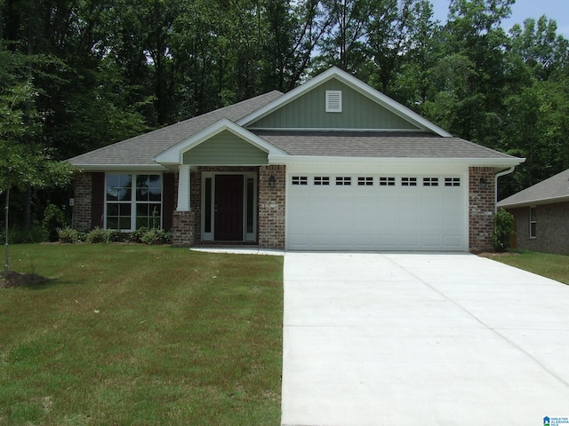 craftsman-style home with a garage and a front yard