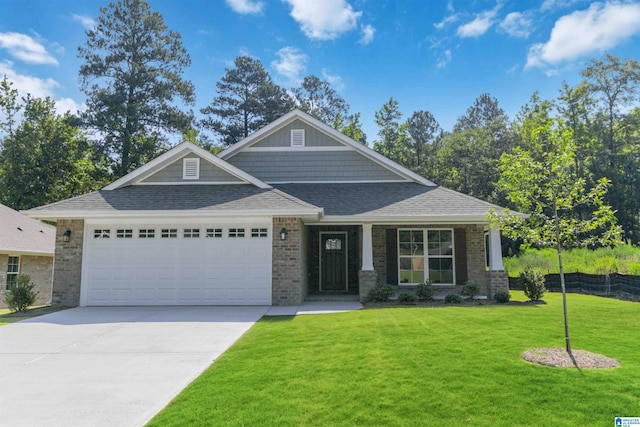 craftsman inspired home featuring brick siding, a front lawn, roof with shingles, a garage, and driveway