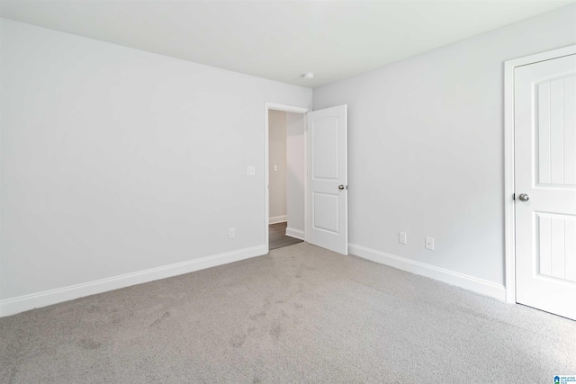 unfurnished bedroom with light carpet