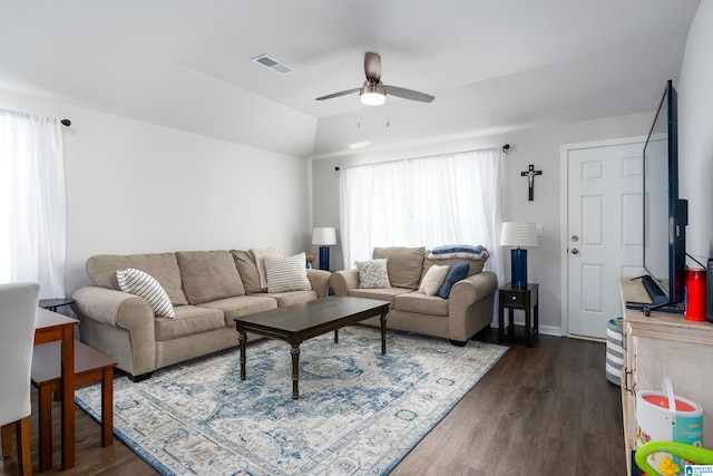 living room featuring ceiling fan, dark hardwood / wood-style floors, and lofted ceiling