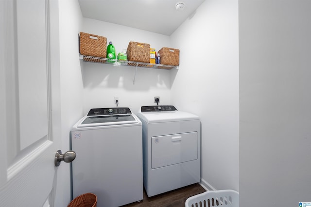 laundry room featuring dark wood-type flooring and washer and clothes dryer