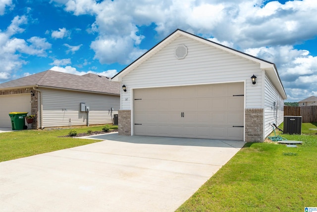 view of front of home featuring a garage and a front lawn