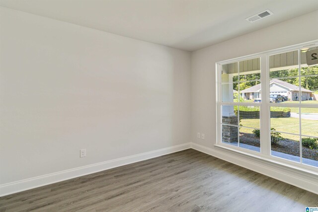 unfurnished living room featuring ceiling fan and hardwood / wood-style floors