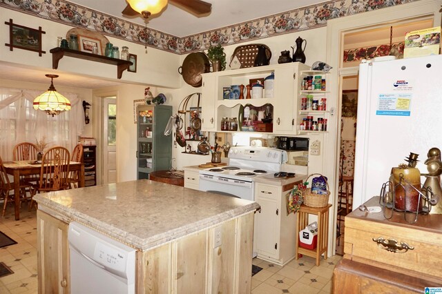 kitchen with ceiling fan, white appliances, hanging light fixtures, and light tile patterned floors