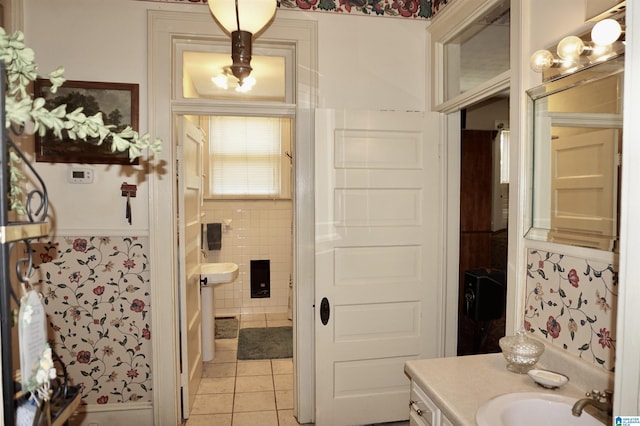 401 SW 8th St, Cullman, AL 35055 - bathroom featuring tile patterned floors, a wainscoted wall, tile walls, and vanity