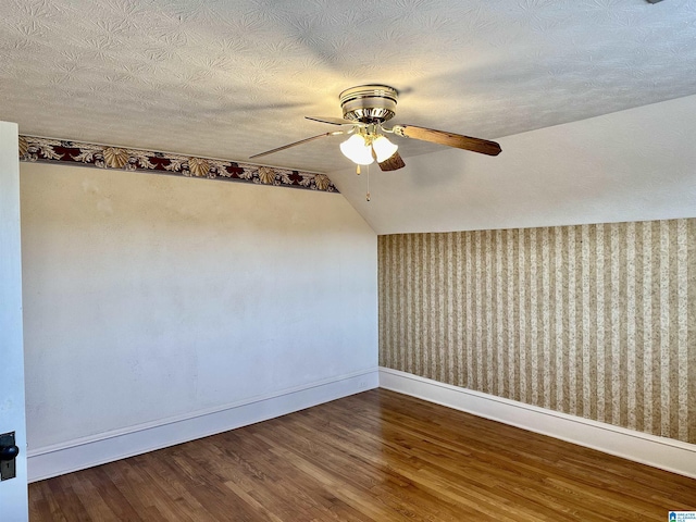 401 SW 8th St, Cullman, AL 35055 - unfurnished room with baseboards, lofted ceiling, wood finished floors, a textured ceiling, and a ceiling fan