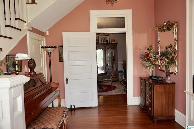 interior space featuring dark hardwood / wood-style floors and high vaulted ceiling