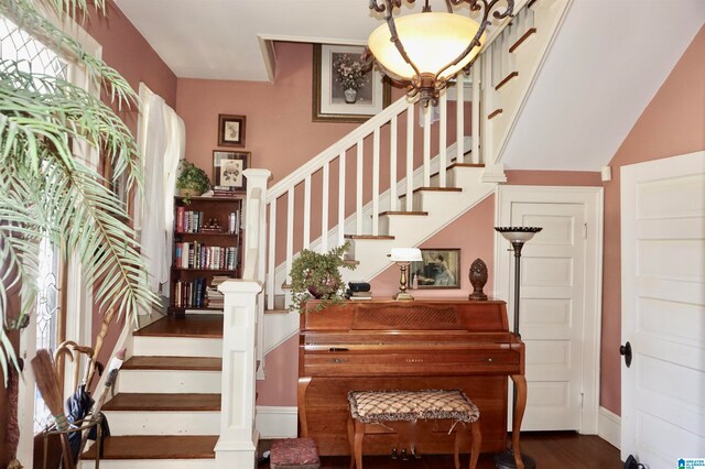 stairway with hardwood / wood-style floors