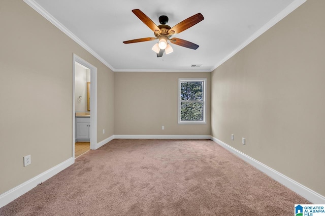 interior space with ceiling fan, crown molding, light colored carpet, and ensuite bathroom