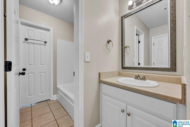 bathroom featuring shower / tub combination, vanity, and tile patterned flooring