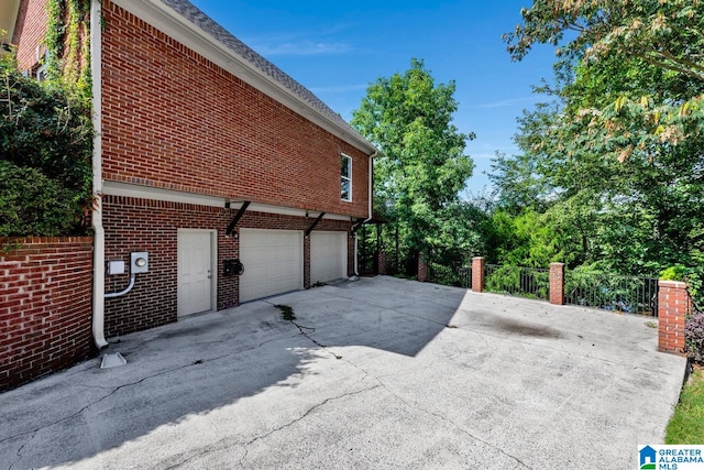 view of side of home with a garage