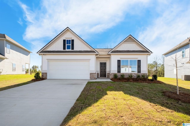 craftsman house featuring a garage and a front yard