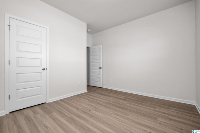 spare room featuring light hardwood / wood-style floors