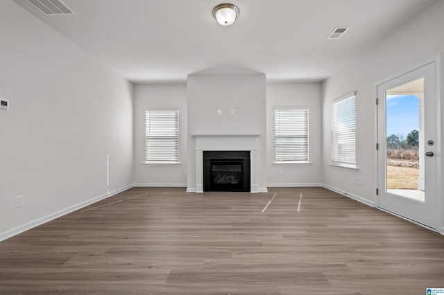 unfurnished living room featuring light wood-type flooring