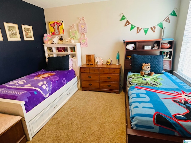 bedroom featuring light carpet