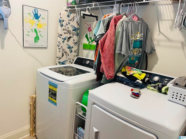 laundry room featuring separate washer and dryer