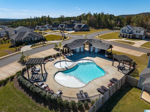 view of swimming pool with a yard and a patio