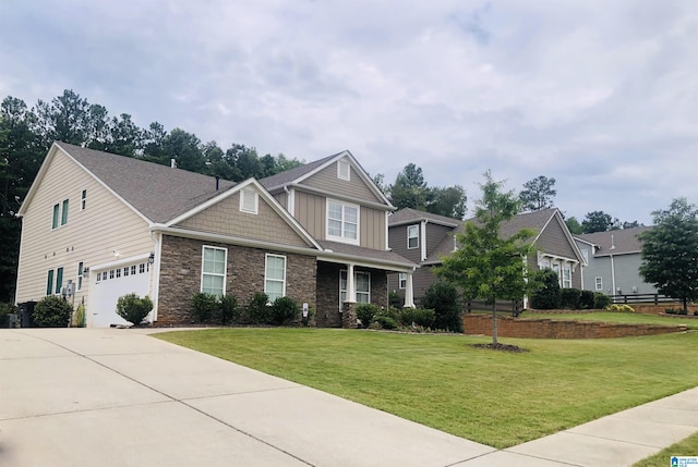 craftsman-style house featuring a garage and a front lawn