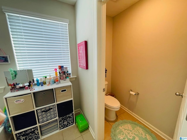 bathroom with tile patterned floors and toilet