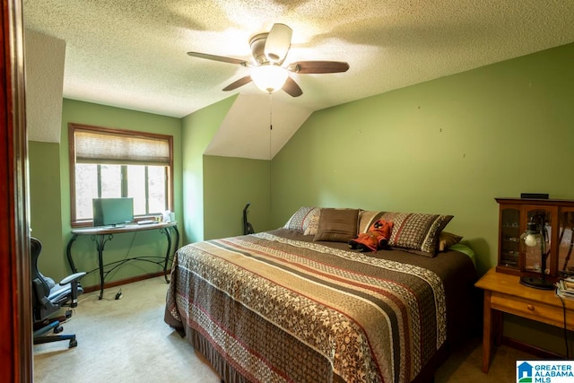 bedroom featuring light carpet, vaulted ceiling, a textured ceiling, and ceiling fan