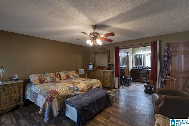 bedroom with dark wood-style floors, ceiling fan, and a textured ceiling