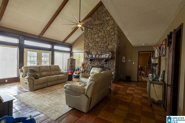 bedroom with ceiling fan, access to exterior, a textured ceiling, and dark wood-type flooring