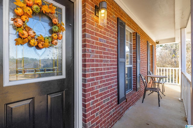 doorway to property with covered porch