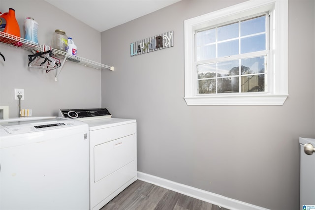 laundry room featuring dark wood-type flooring and washer and dryer