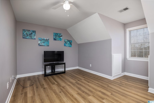 bonus room with hardwood / wood-style flooring, lofted ceiling, and ceiling fan