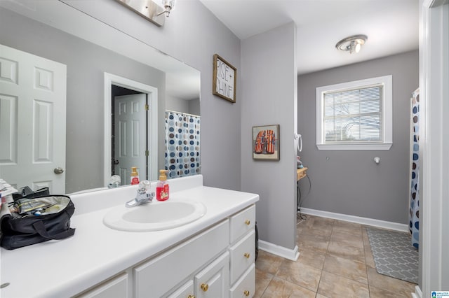 bathroom featuring tile patterned flooring and vanity