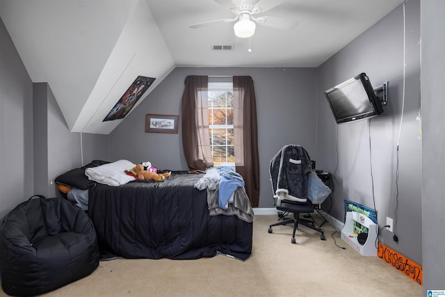 carpeted bedroom with vaulted ceiling and ceiling fan