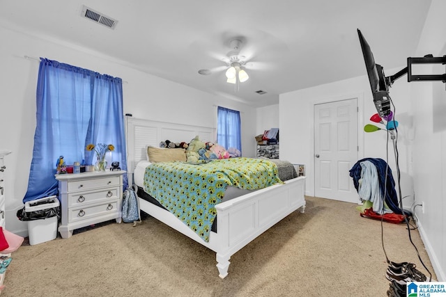 carpeted bedroom with ceiling fan