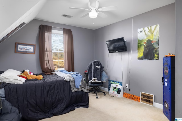 bedroom with lofted ceiling, ceiling fan, and carpet flooring