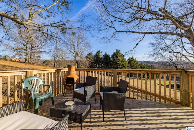 wooden terrace with outdoor lounge area