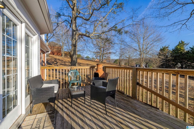 deck featuring outdoor lounge area